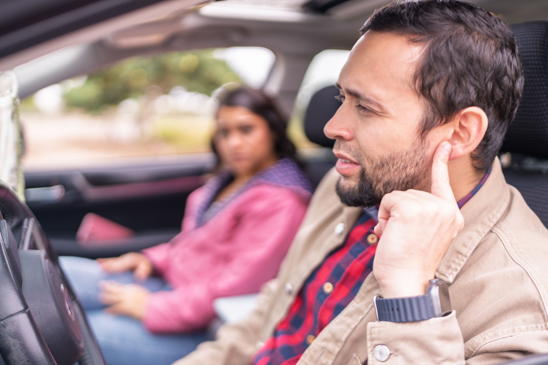Couple having car trouble on road trip